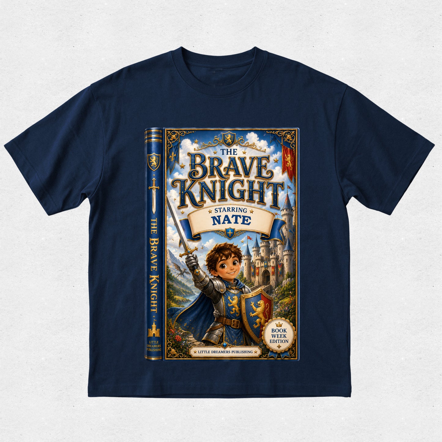 A navy blue short-sleeve t-shirt with a large graphic print on the front depicting a book cover for 'The Brave Knight' featuring a knight in armor and the text 'Starring Nate'.