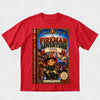 A red short-sleeve crewneck t-shirt featuring a large graphic print of a children's book styled as 'The Fireman Adventure' on the front, displayed against a light gray textured background.