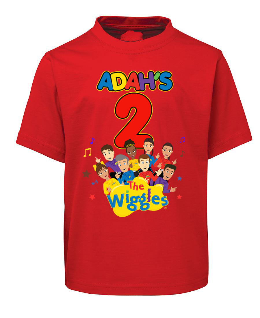 Red t-shirt with 'The Wiggles' design and text on a white background