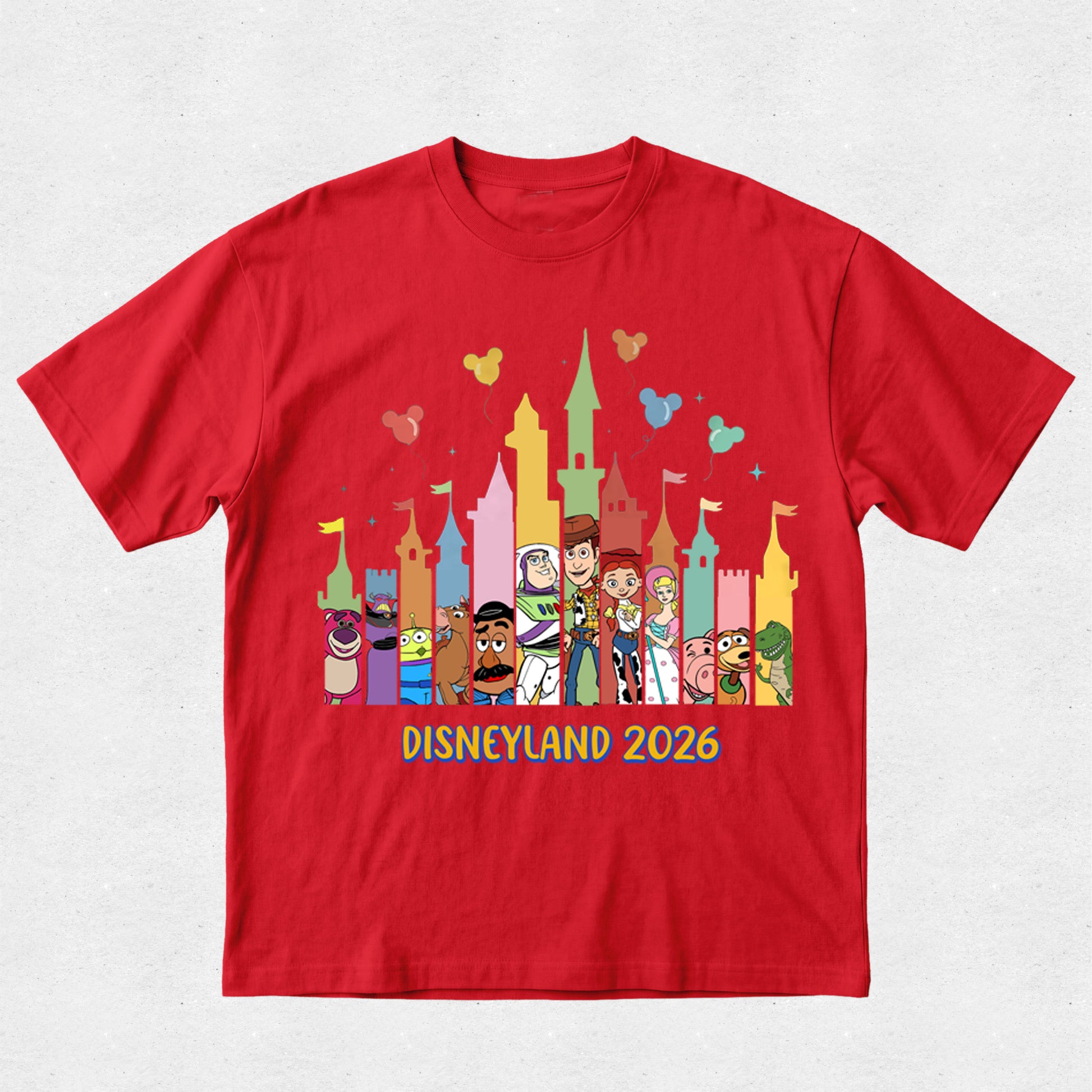 Red t-shirt with colorful Disney characters and 'Disneyland 2026' text on a white background