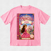 A pink short-sleeve crewneck t-shirt featuring a large graphic print of the book cover for 'The Lost Princess: Starring Eliza' on the front, displayed flat against a light gray textured background.