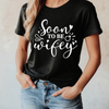 Person wearing a black t-shirt with 'Soon to be wifey' text.
