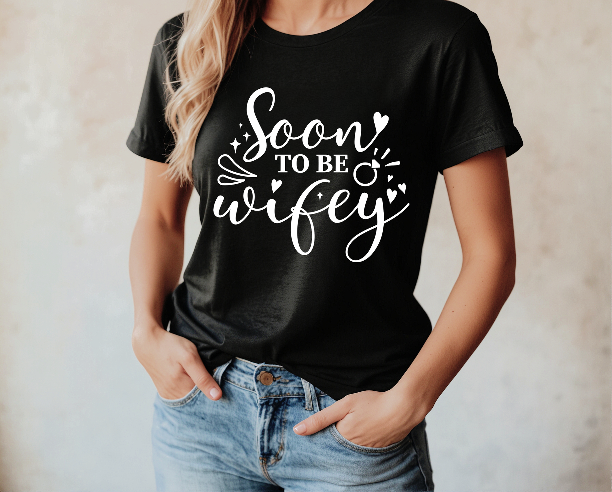 Person wearing a black t-shirt with 'Soon to be wifey' text.