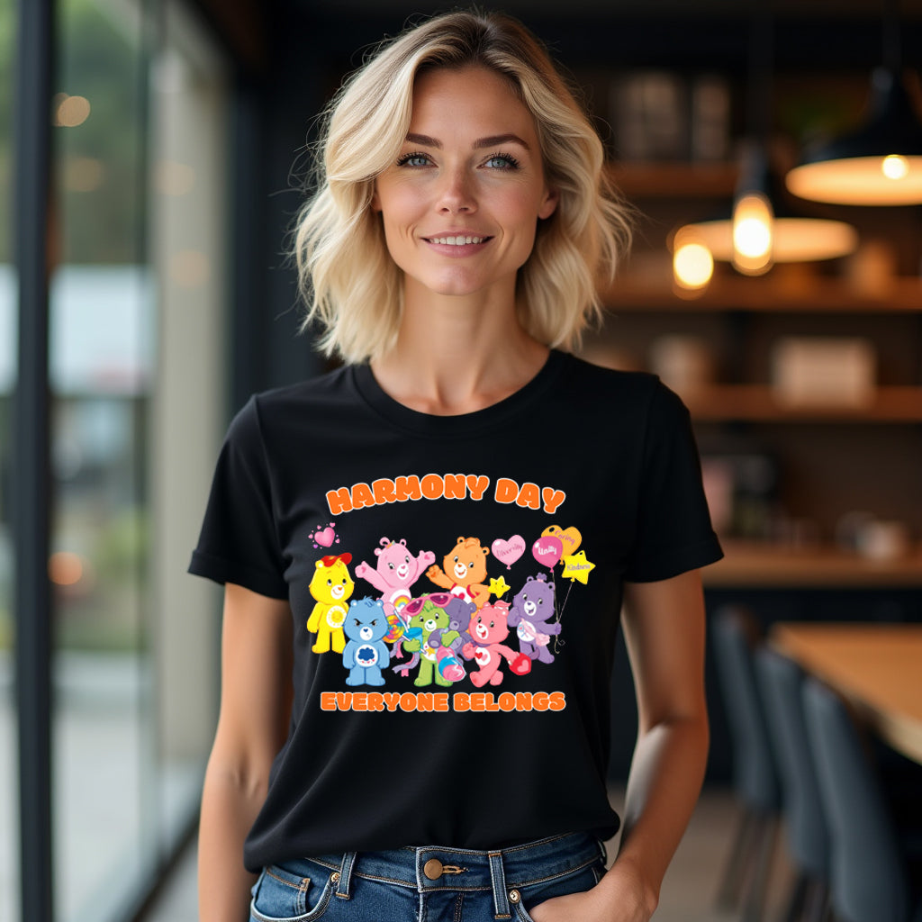 Woman wearing a black t-shirt with colorful graphic care bears and text in a casual setting