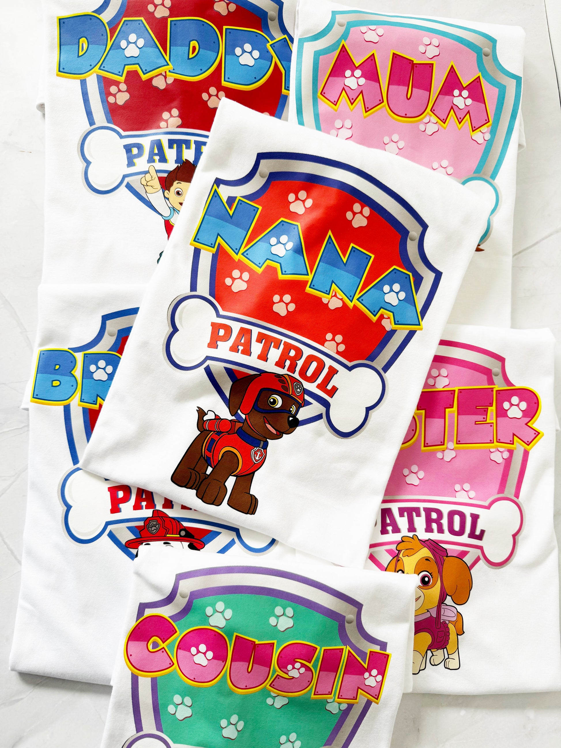 Child wearing personalised birthday pup shirt from Paw Patrol inspired family t-shirt set.
