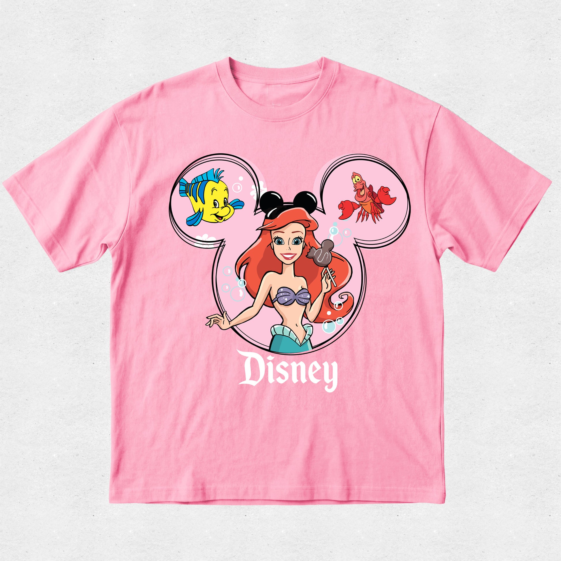 Pink t-shirt with Disney character design on a light gray background