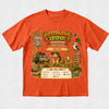 A bright orange short-sleeve t-shirt with a large, colorful 'Australian Zoo Adventure' graphic on the front, featuring cartoon animals and safari vehicles on a light gray textured background.