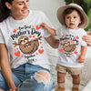 Woman and child wearing matching 'Our first Mother's Day together 2026' t-shirts with sloth graphics.