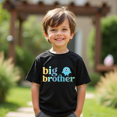 Child wearing a black t-shirt with 'big brother' text, standing outdoors.