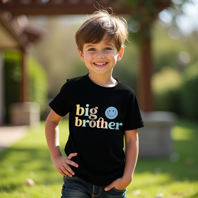 Child wearing a black 'big brother' shirt outdoors