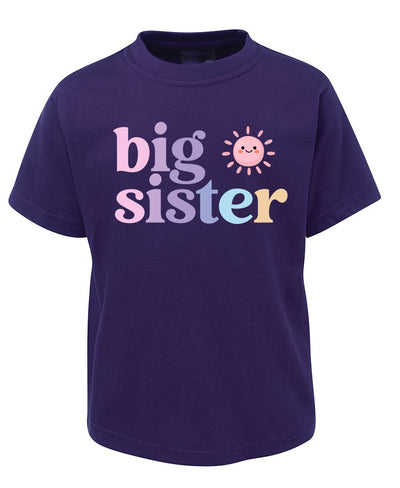 Purple t-shirt with 'big sister' text and sun graphic on a white background