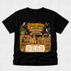 A black short-sleeve crewneck t-shirt featuring a large, colorful graphic print on the front. The graphic is themed around a 'Book Week Quest Outback Adventure' and depicts a cartoon character in a safari hat with a magnifying glass, surrounded by various animals, a windmill, and a checklist titled 'CAN YOU FIND?'.