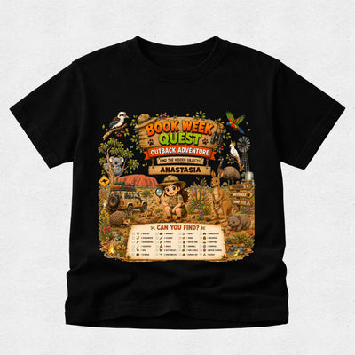 A black short-sleeve crewneck t-shirt featuring a large, colorful graphic print on the front. The graphic is themed around a 'Book Week Quest Outback Adventure' and depicts a cartoon character in a safari hat with a magnifying glass, surrounded by various animals, a windmill, and a checklist titled 'CAN YOU FIND?'.