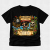 A black short-sleeve crewneck t-shirt featuring a large, colorful pirate-themed graphic on the front. The graphic depicts a book-themed pirate adventure with a ship, skull, treasure chest, and a pirate character, with text reading 'BOOK WEEK QUEST HAYDEN PIRATE ADVENTURE' and a checklist at the bottom.