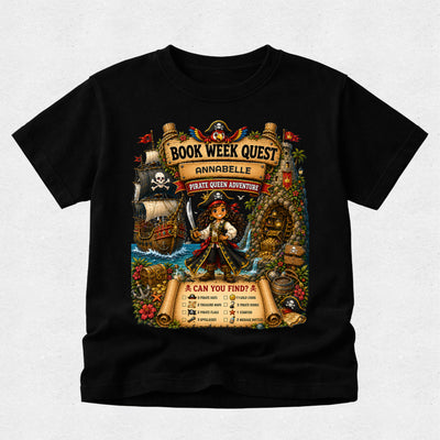 A black short-sleeve crewneck t-shirt featuring a large, colorful graphic print on the front. The graphic is themed around a pirate queen book club event, titled 'Book Week Quest: Annabel Pirate Queen Adventure', with illustrations of a pirate, a ship, a treasure chest, and a scroll showing a 'Can You Feed?' food challenge.