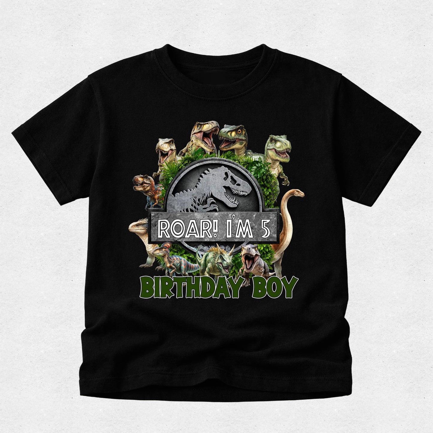 Black t-shirt with dinosaur graphic and 'Roar! I'm 5 Birthday Boy' text on a light gray background