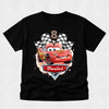 Black t-shirt with a cartoon car design and 'Daniel' on a light gray background