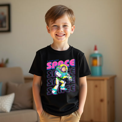 Child wearing a black t-shirt with a colorful graphic design in a living room setting
