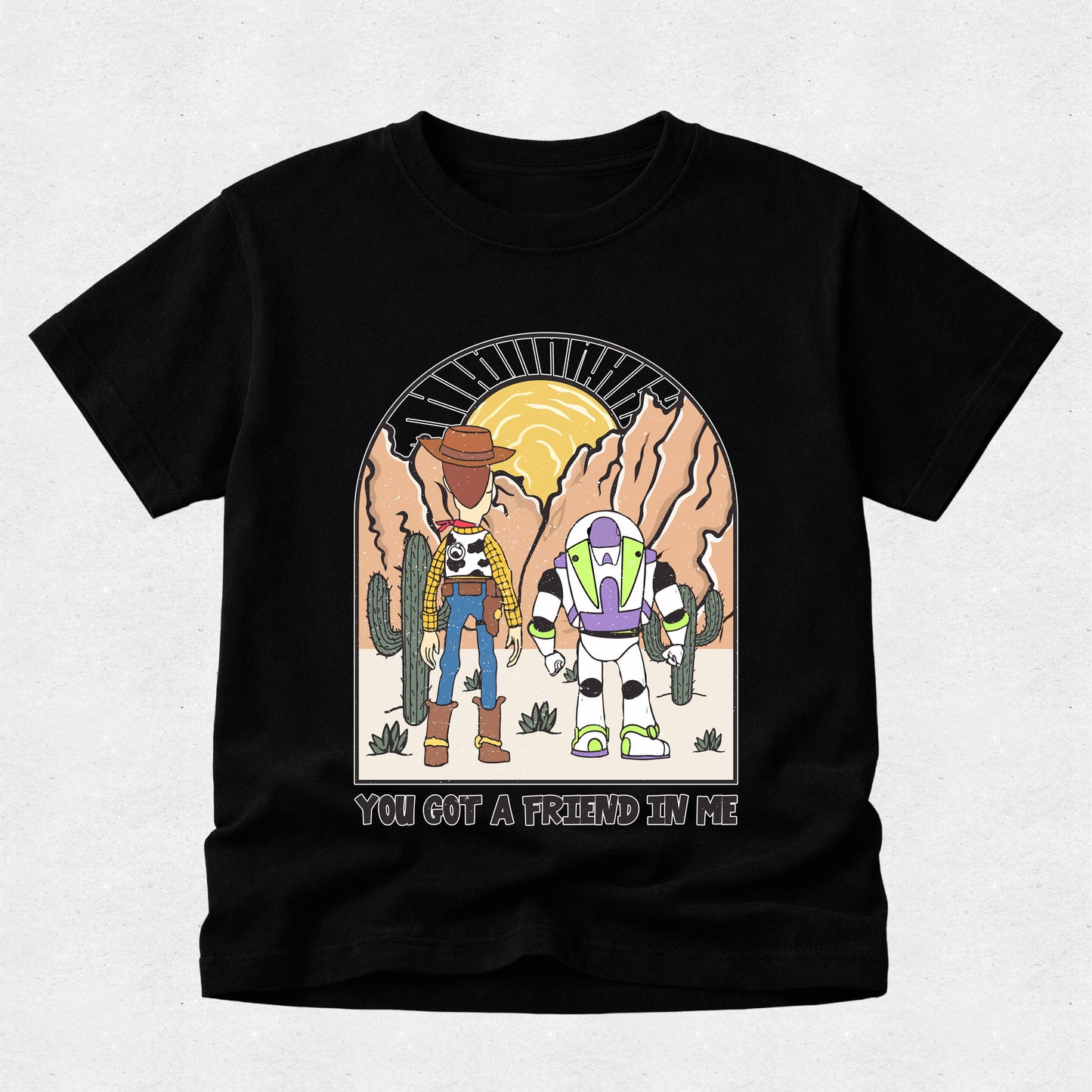 Black t-shirt with cartoon characters and 'You Got a Friend in Me' text on a light gray background