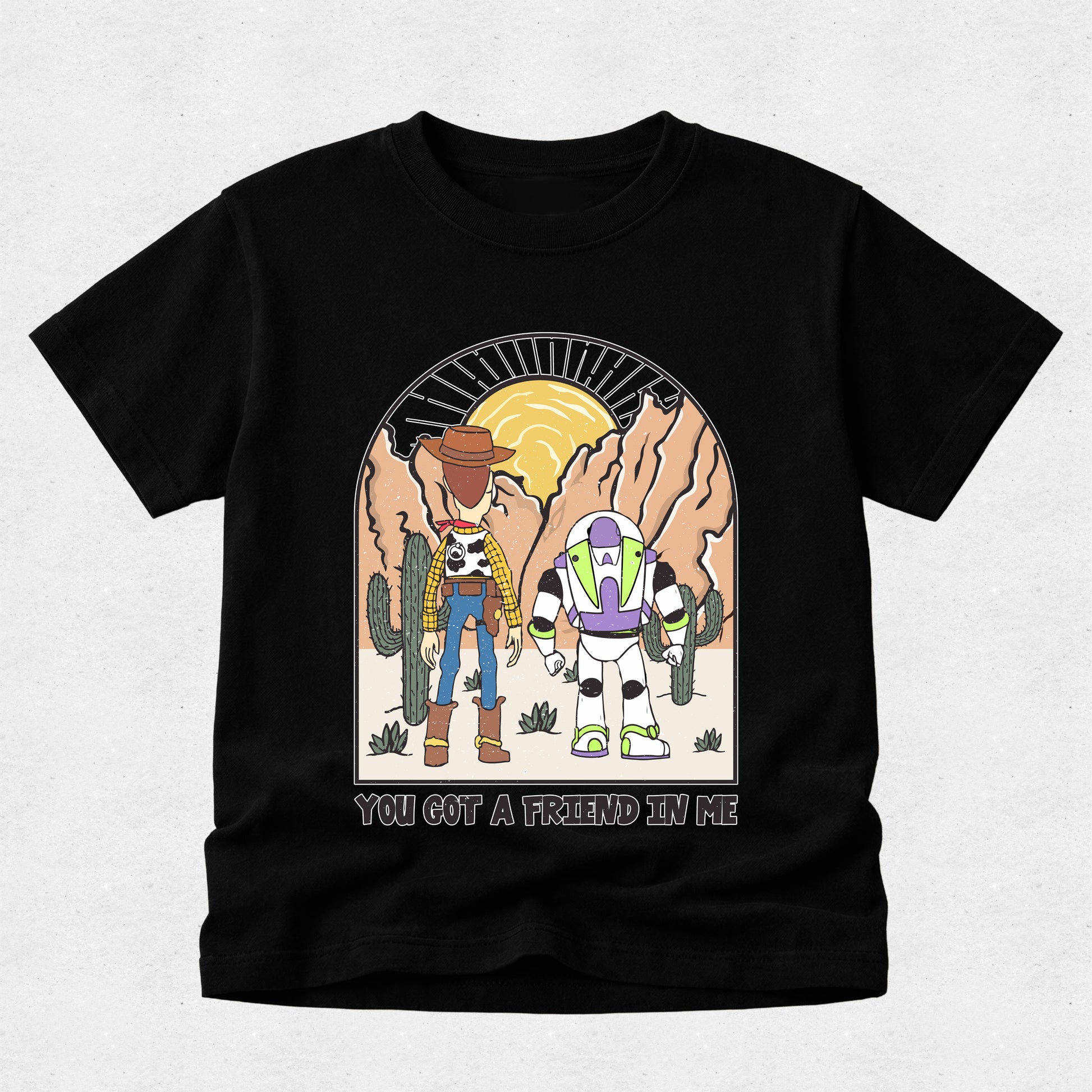 Black t-shirt with cartoon characters and 'You Got a Friend in Me' text on a light gray background