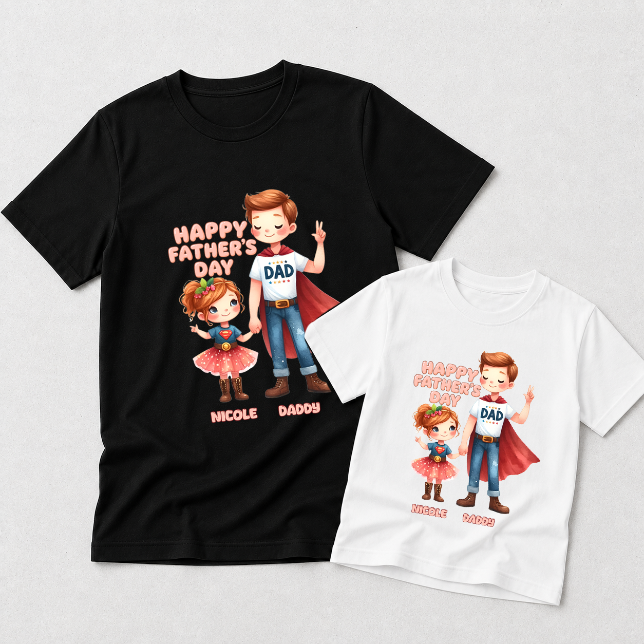 Two custom graphic t-shirts displayed on a light gray background, one black and one white. Both shirts feature a cartoon illustration of a father and daughter in superhero costumes with the text 'HAPPY FATHER'S DAY' and 'NICOLE DADDY'.