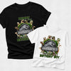 Black and white t-shirts with dinosaur-themed birthday design on a light gray background
