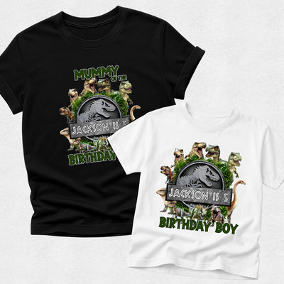 Black and white t-shirts with dinosaur-themed birthday design on a light gray background