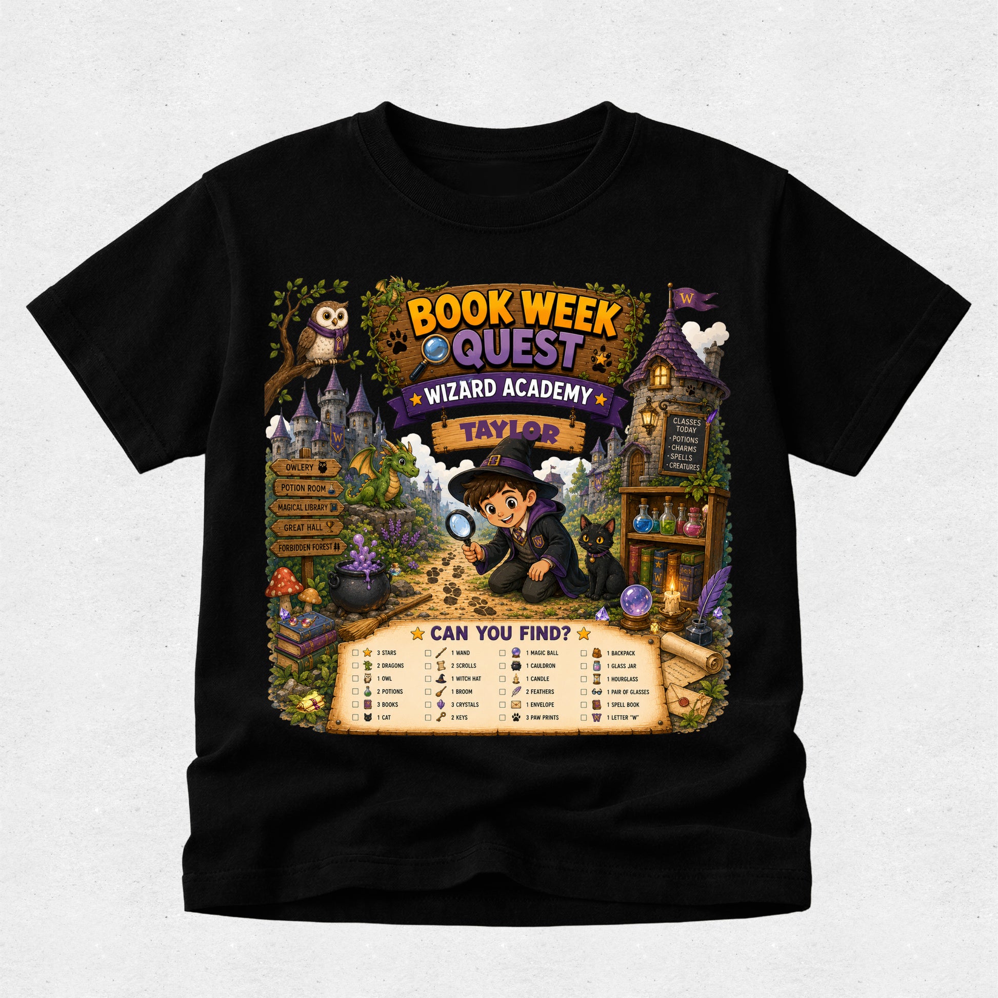 A black short-sleeve t-shirt with a large, colorful wizard-themed graphic on the front. The graphic features the text 'BOOK WEEK QUEST', 'WIZARD ACADEMY', and 'TAYLOR' above an illustration of a wizard with a magnifying glass, a castle, an owl, and a treasure chest.