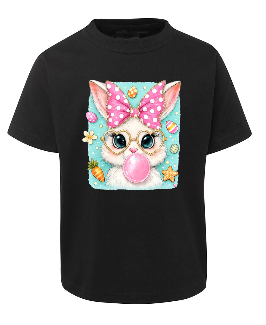 Black t-shirt with a colorful cat graphic featuring a polka dot bow, glasses, and a bubble gum ball on a white background.