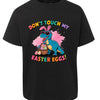 Black t-shirt with a colorful dinosaur graphic and Easter text on a white background