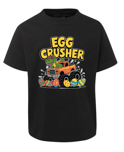 Black t-shirt with a colorful graphic of a truck and dinosaur crushing Easter eggs, labeled 'Egg Crusher'.