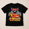 Black t-shirt with a cartoon car design and 'Nick's 6th Birthday' text on a beige background