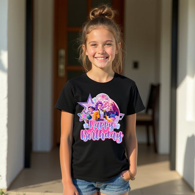 Young girl wearing a black t-shirt with a colorful 'Happy Birthday' design, standing outdoors.