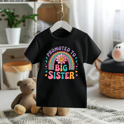 Girls t-shirt with colourful “Promoted to Big Sister” design, ideal for pregnancy announcements and sibling reveal celebrations.