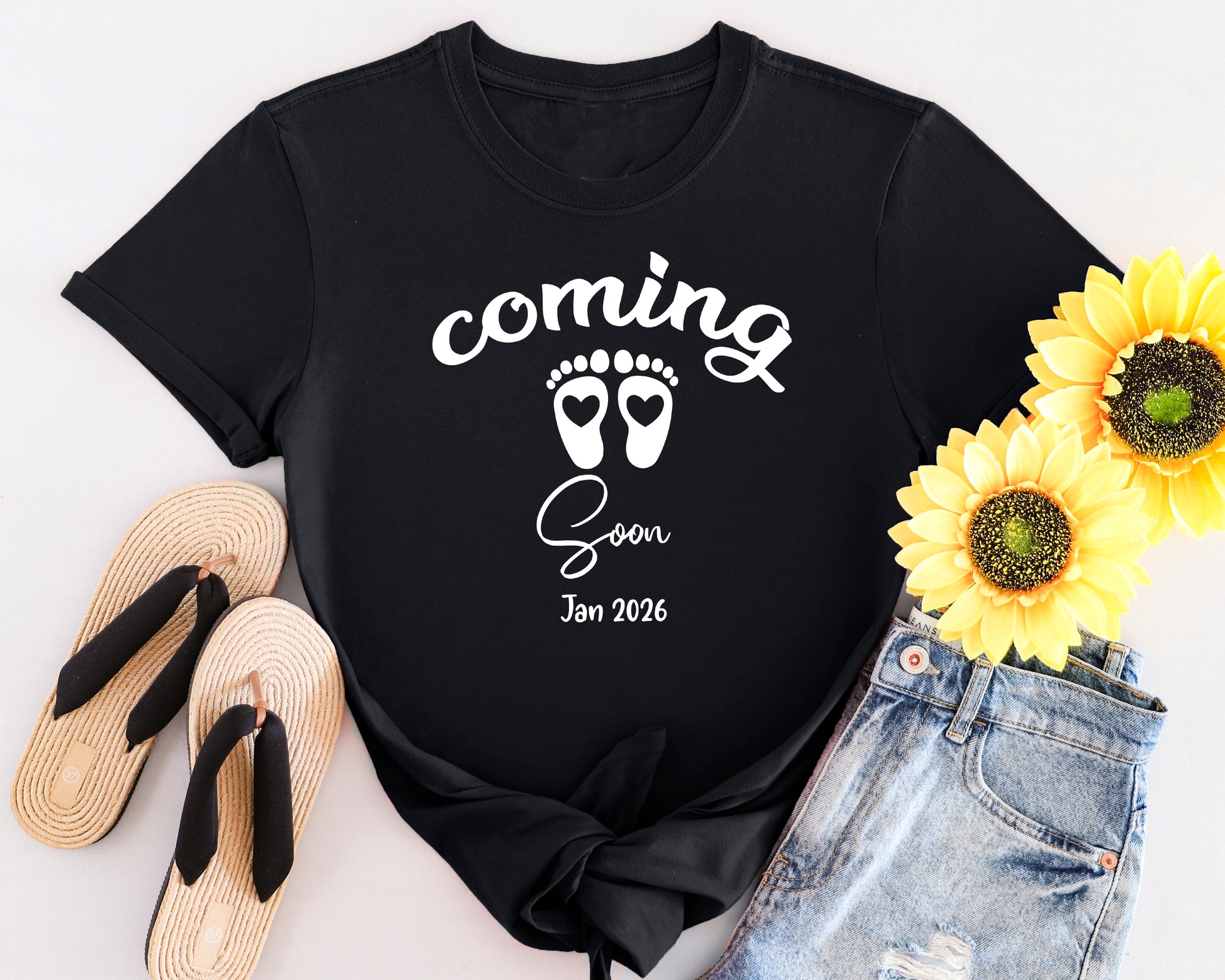 Classic style maternity shirt with “Coming Soon” text and baby footprints graphic, perfect for pregnancy announcements.