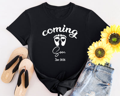 Classic style maternity shirt with “Coming Soon” text and baby footprints graphic, perfect for pregnancy announcements.