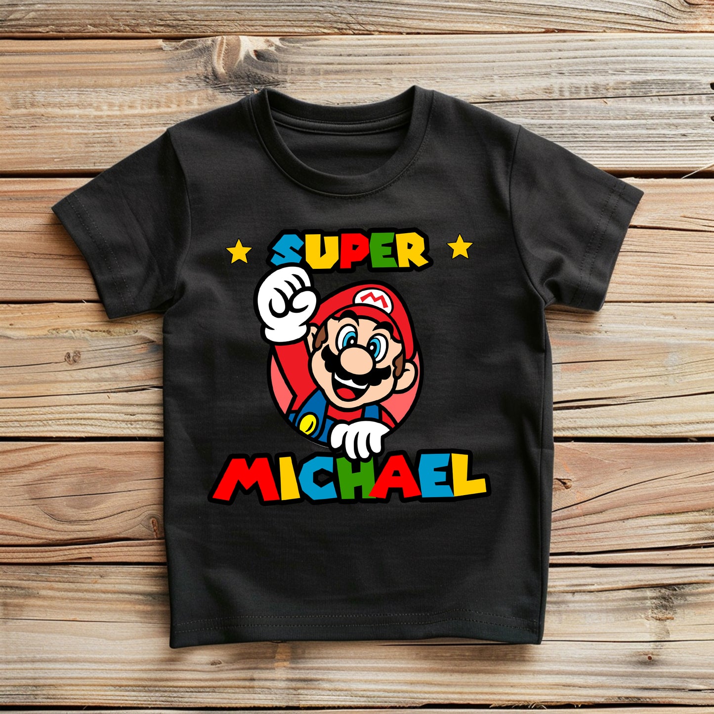 Flat lay of birthday tee showing colorful design and personalization options
