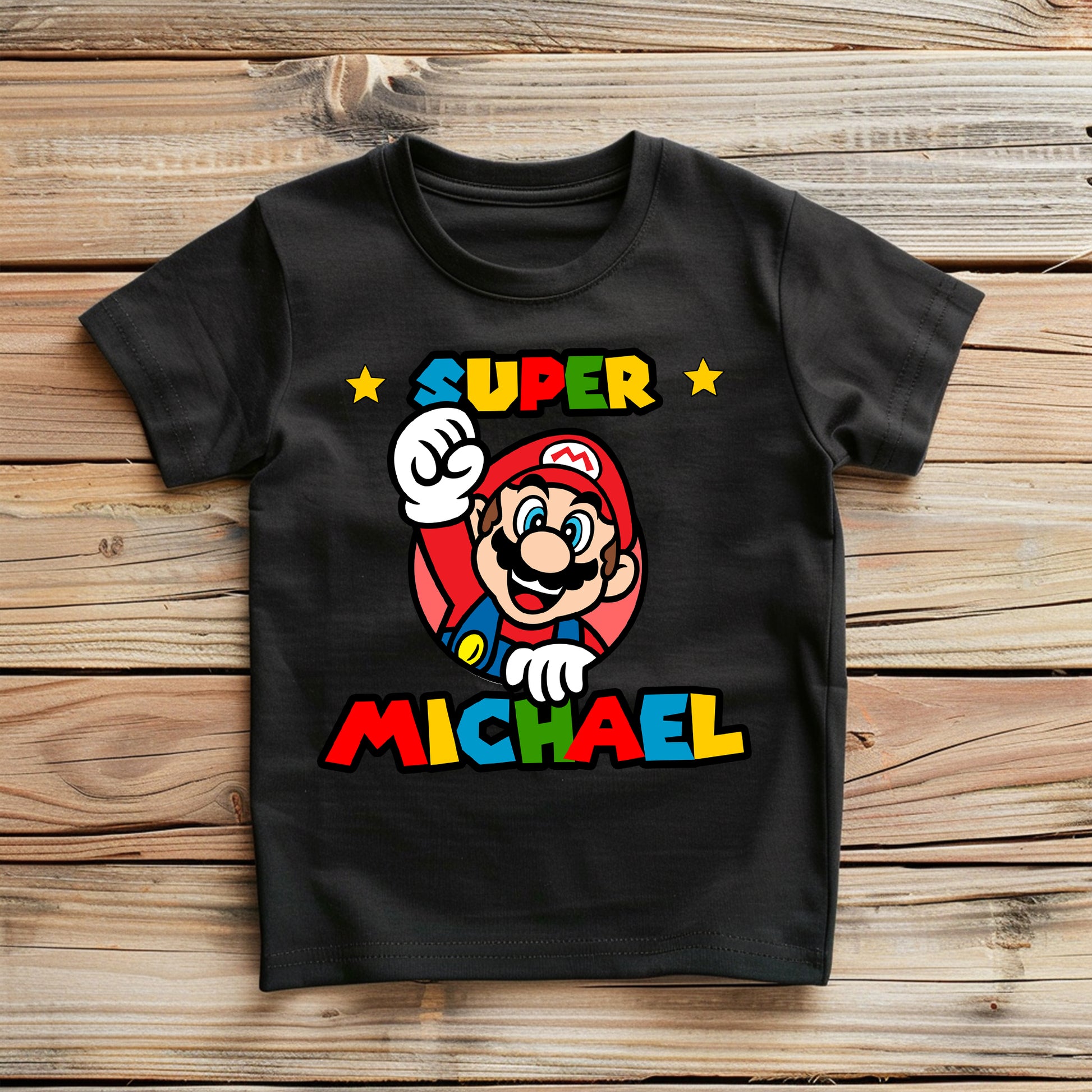 Flat lay of birthday tee showing colorful design and personalization options