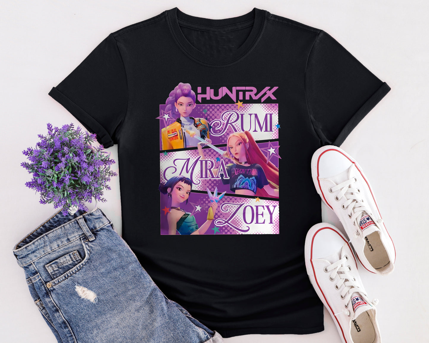 Flat lay of K-Pop Demon Hunters inspired t-shirt featuring animated pop group design in Netflix anime style.