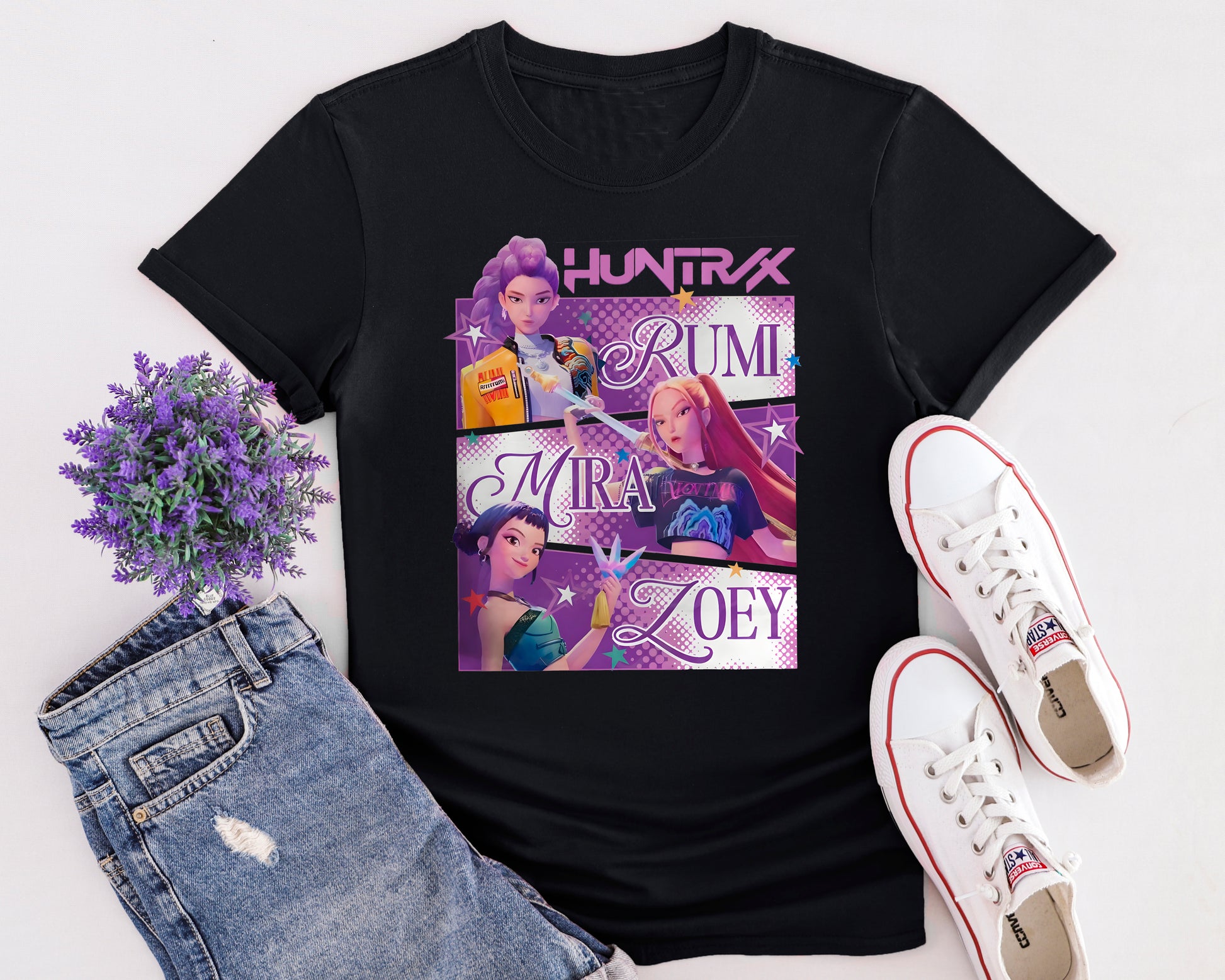 Flat lay of K-Pop Demon Hunters inspired t-shirt featuring animated pop group design in Netflix anime style.