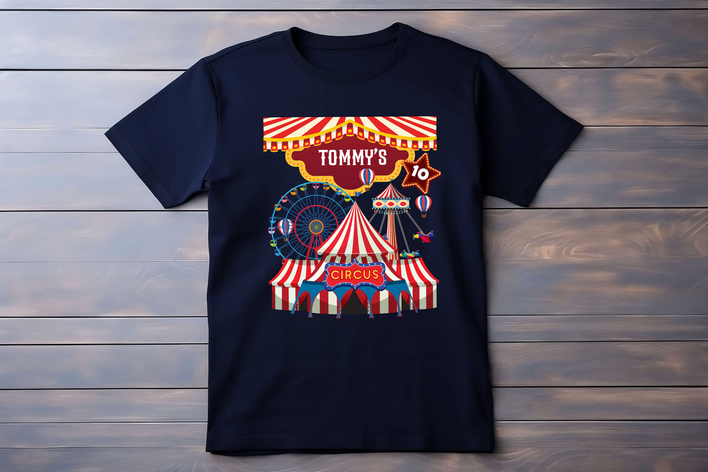 Black t-shirt with a colorful circus design on a wooden background