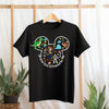Black t-shirt with Disney character design and text on a hanger against a light background