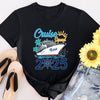 Black t-shirt with 'Cruise Squad 2025' design, sunflowers, flip-flops, and denim shorts on a white background