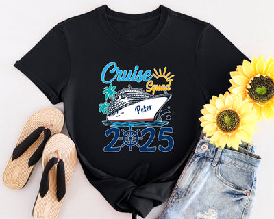 Black t-shirt with 'Cruise Squad 2025' design, sunflowers, flip-flops, and denim shorts on a white background