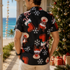 Man wearing a Christmas-themed shirt with beach and decorated tree in the background