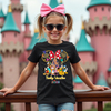 Person wearing Golden Magical Dreams t-shirt, styled for a magical theme park vacation.