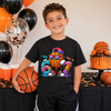 Boy wearing "I Was 6 Now I'm 7" basketball birthday t-shirt at a baskertball-themed 7th birthday party.