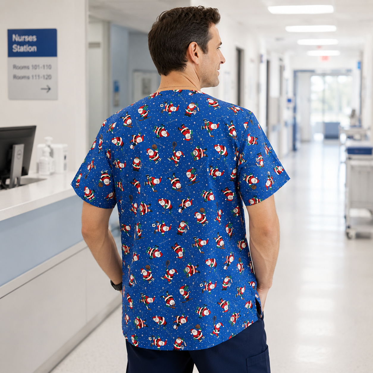 Person wearing a blue scrub top with Santa Claus pattern in a hospital setting
