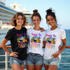 Three girls standing in front of a cruise ship wearing matching cruise birthday trip shirts