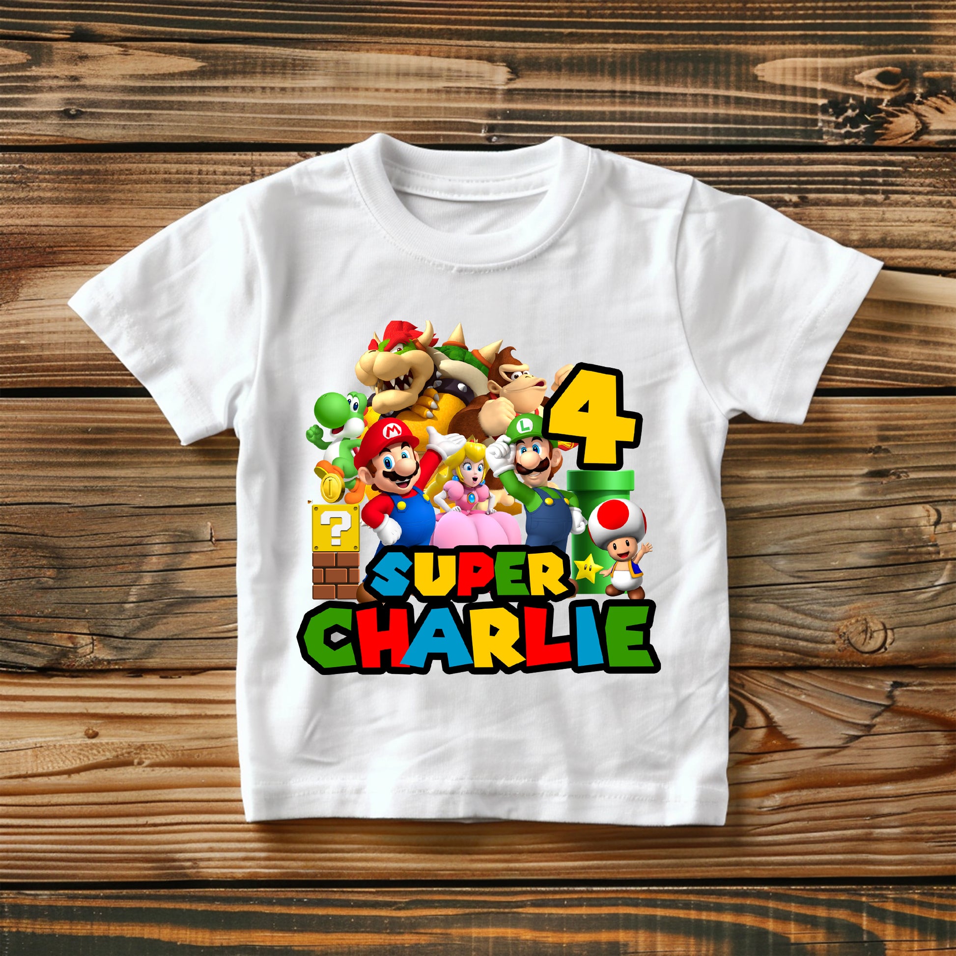 Flat lay of Super Mario birthday t-shirt showing customization options and bright design